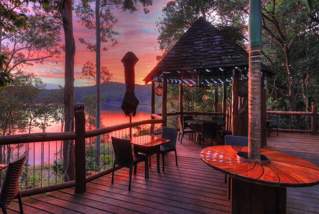 An evening deck overlooking the hinterland lake at sunset
